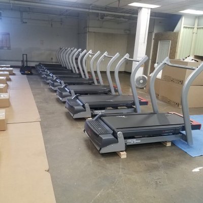 treadmills lined up and being built